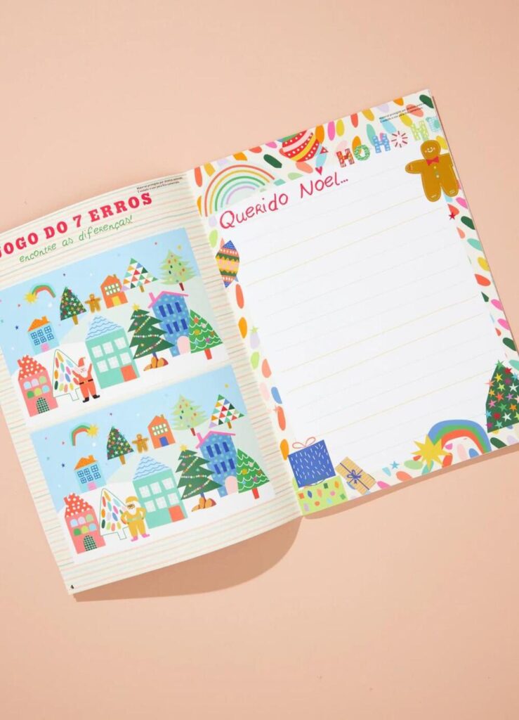 Livro infantil de Natal aberto com página para carta ao Papai Noel e jogo dos sete erros colorido.